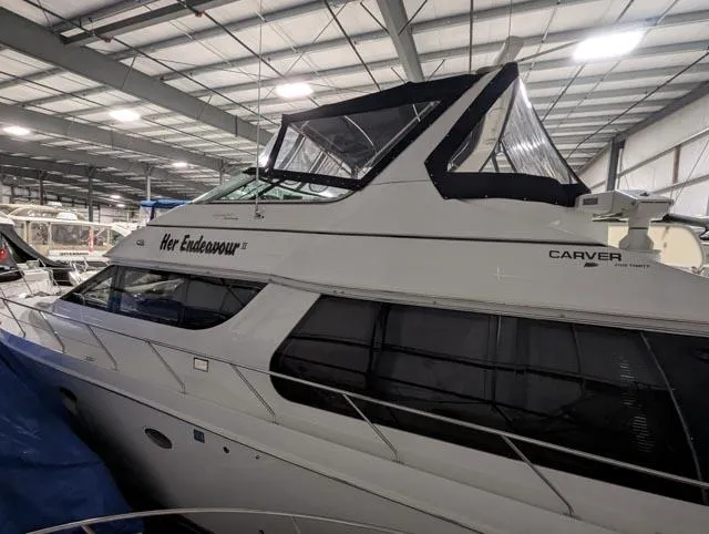 Her Endeavour II Yacht Photos Pics 1999 Carver 530 Voyager Pilothouse yacht in indoor storage facility.