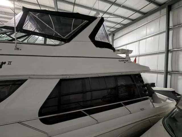 Her Endeavour II Yacht Photos Pics 1999 Carver 530 Voyager Pilothouse yacht in storage, side view.
