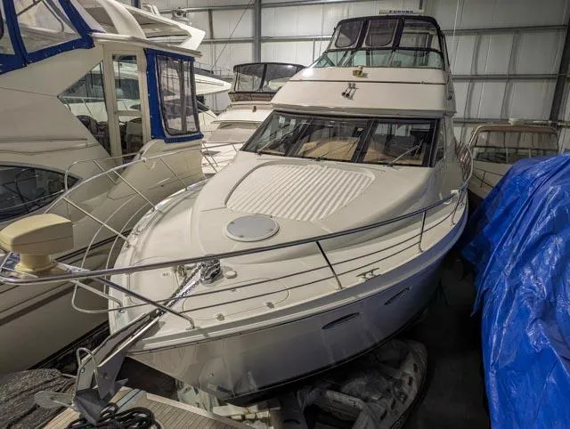 Her Endeavour II Yacht Photos Pics 1999 Carver 530 Voyager Pilothouse yacht in storage, surrounded by other boats.