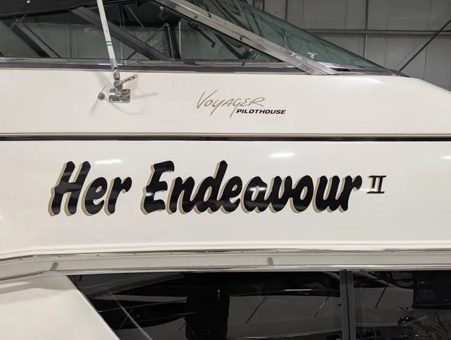 Her Endeavour II Yacht Photos Pics 1999 Carver 530 Voyager Pilothouse boat named "Her Endeavour II" in a marina.