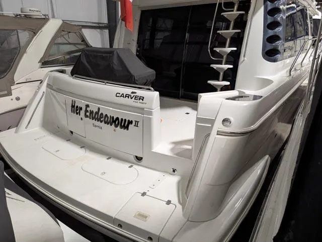 Her Endeavour II Yacht Photos Pics 1999 Carver 530 Voyager Pilothouse yacht docked in a marina.