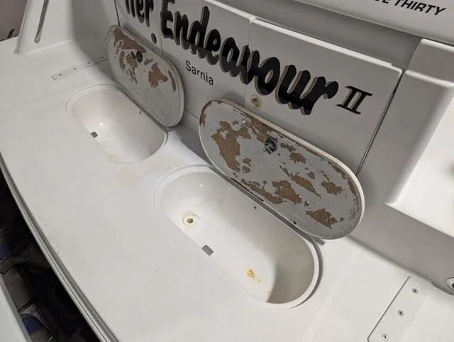 Her Endeavour II Yacht Photos Pics 1999 Carver 530 Voyager Pilothouse boat deck with storage compartments, showing wear and tear.