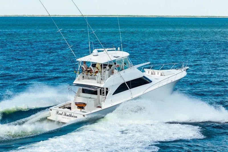 Reel Southern Yacht Photos Pics 2006 Viking 56 Convertible yacht cruising on open blue waters.