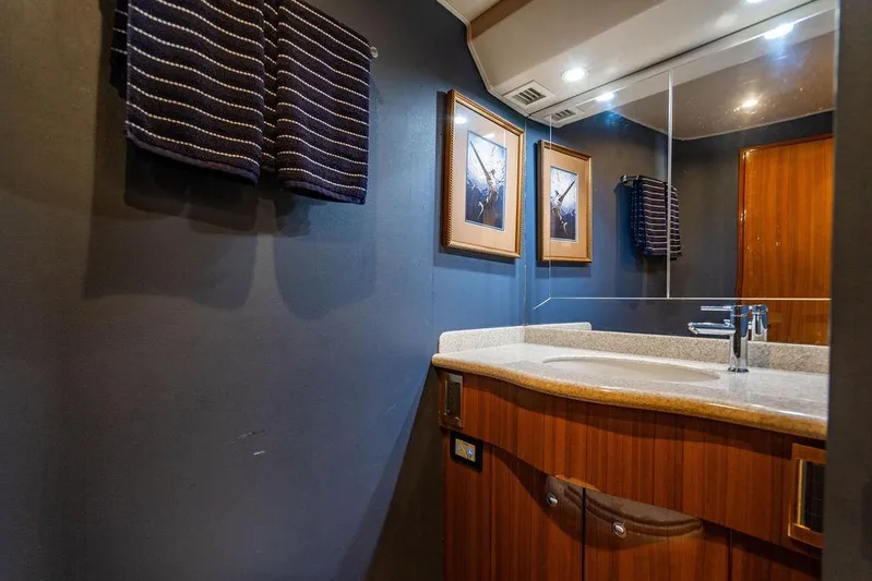 Reel Southern Yacht Photos Pics Luxurious bathroom in 2006 Viking 56 Convertible yacht with modern fixtures and elegant decor.