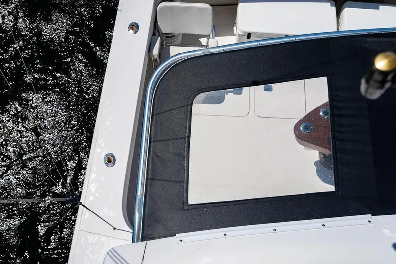 Reel Southern Yacht Photos Pics Overhead view of 2006 Viking 56 Convertible yacht deck with water reflection.