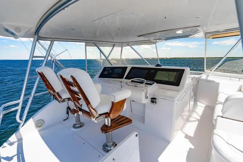 Reel Southern Yacht Photos Pics Helm of 2006 Viking 56 Convertible yacht with ocean view and modern controls.
