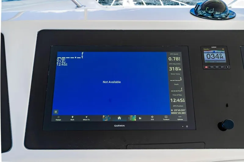 Reel Southern Yacht Photos Pics Control panel of a 2006 Viking 56 Convertible yacht with Garmin display.