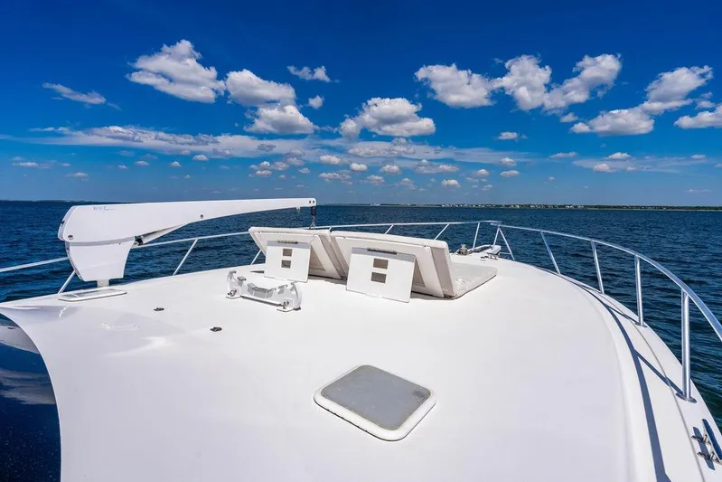Reel Southern Yacht Photos Pics 2006 Viking 56 Convertible yacht deck with ocean view and clear blue sky.
