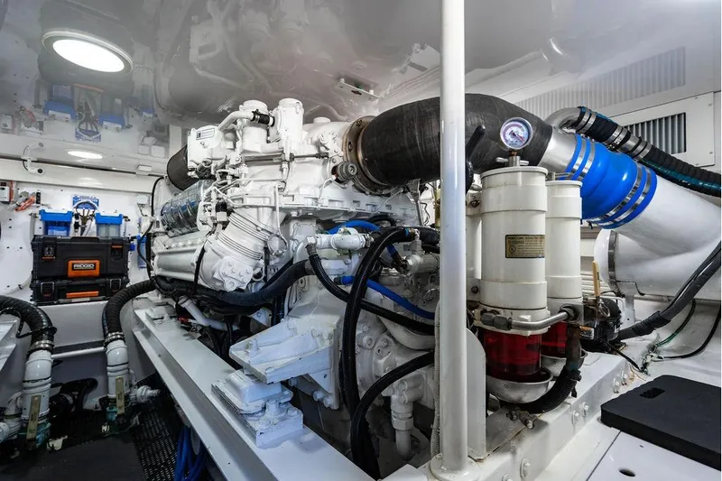 Reel Southern Yacht Photos Pics Engine room of 2006 Viking 56 Convertible yacht, showcasing detailed machinery and components.