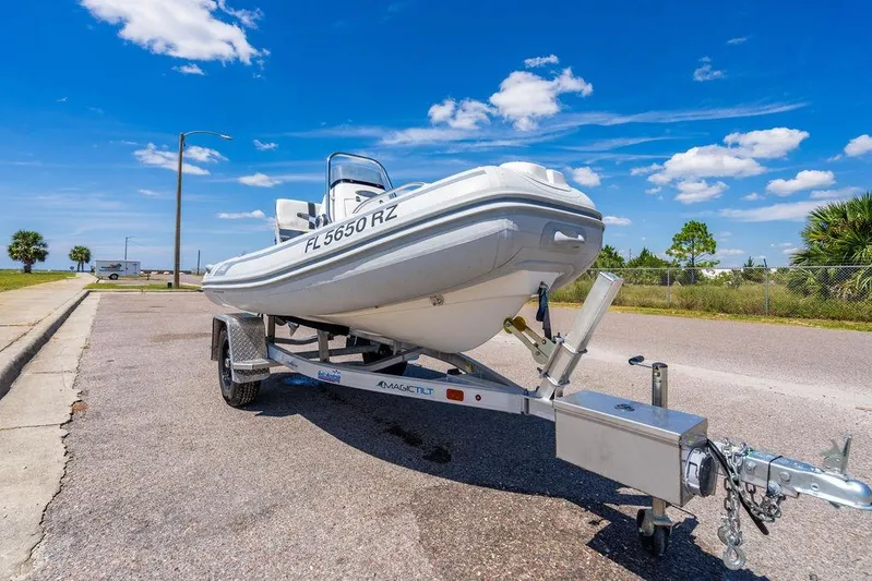 Reel Southern Yacht Photos Pics A 2006 Viking 56 Convertible boat on a trailer under a clear blue sky.