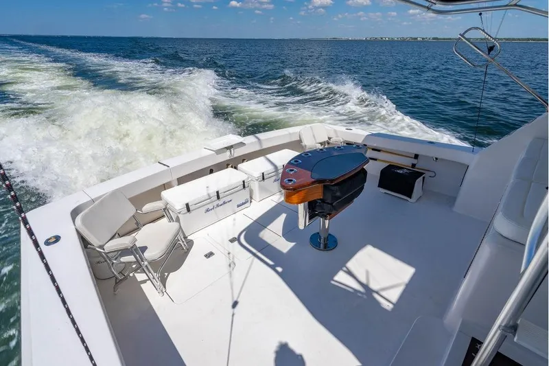 Reel Southern Yacht Photos Pics 2006 Viking 56 Convertible yacht deck with seating and ocean view.