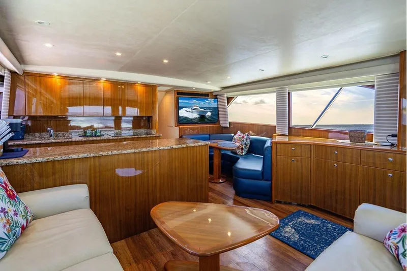 Reel Southern Yacht Photos Pics Luxurious interior of a 2006 Viking 56 Convertible yacht with elegant wood finishes.