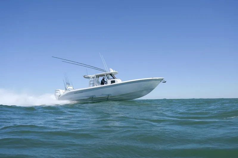  Yacht Photos Pics 2025 Solace 37 CS boat cruising on open water under clear blue sky.