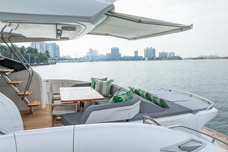 Cinderella Yacht Photos Pics Luxurious 2017 Princess S65 yacht with elegant outdoor seating and scenic waterfront view.
