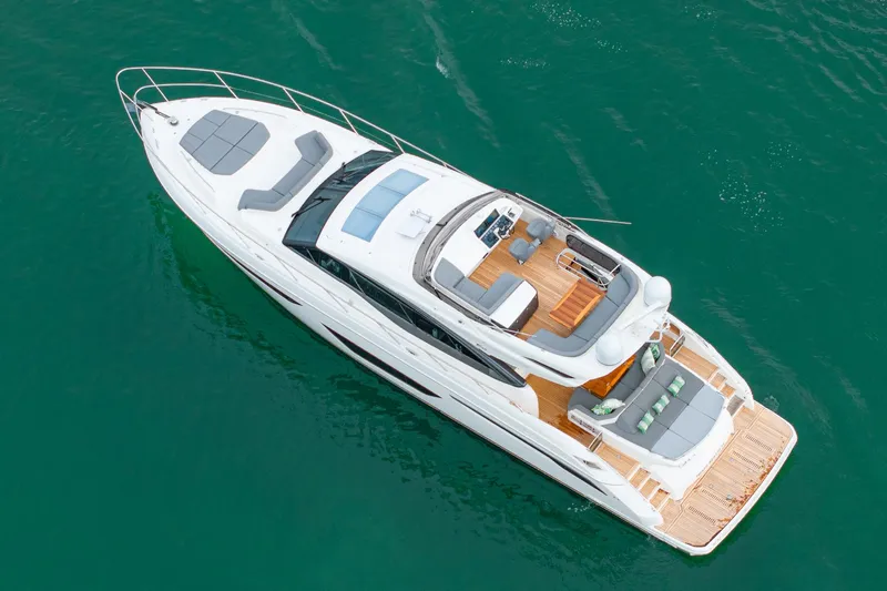 Cinderella Yacht Photos Pics Aerial view of 2017 Princess S65 luxury yacht on clear water.