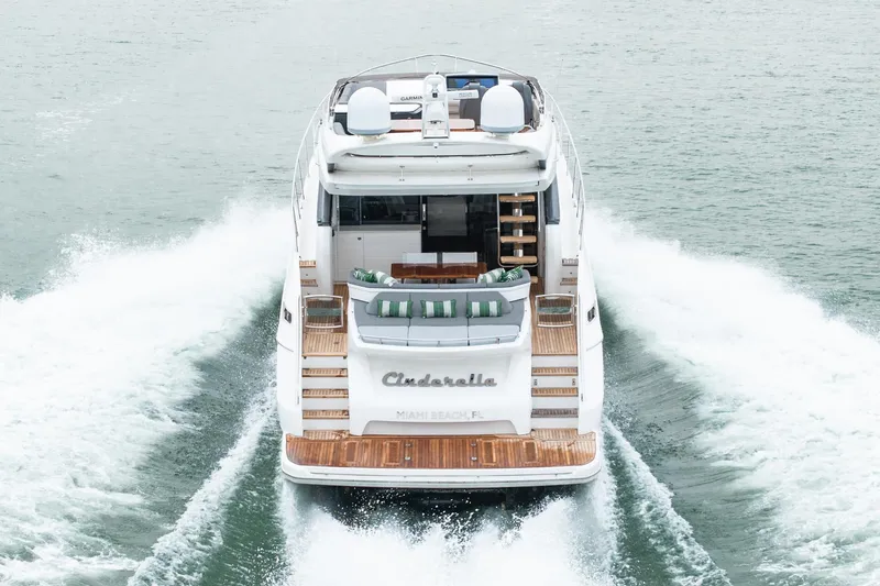 Cinderella Yacht Photos Pics Luxurious 2017 Princess S65 yacht cruising on open water, rear view.