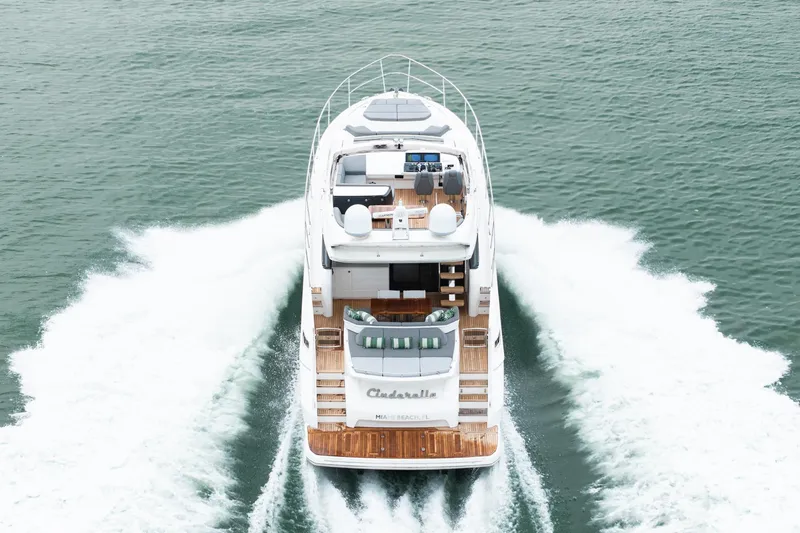 Cinderella Yacht Photos Pics Luxury 2017 Princess S65 yacht cruising on open water, rear view.