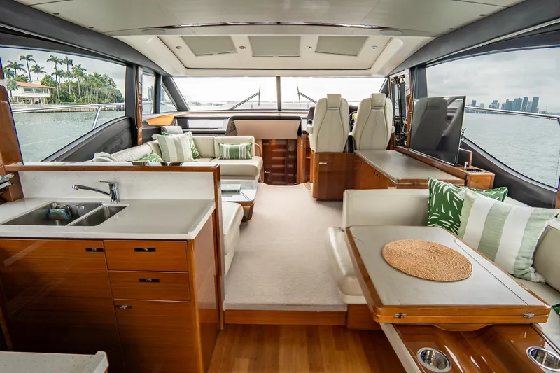 Cinderella Yacht Photos Pics Luxurious 2017 Princess S65 yacht interior with elegant seating, wood finishes, and scenic ocean views.