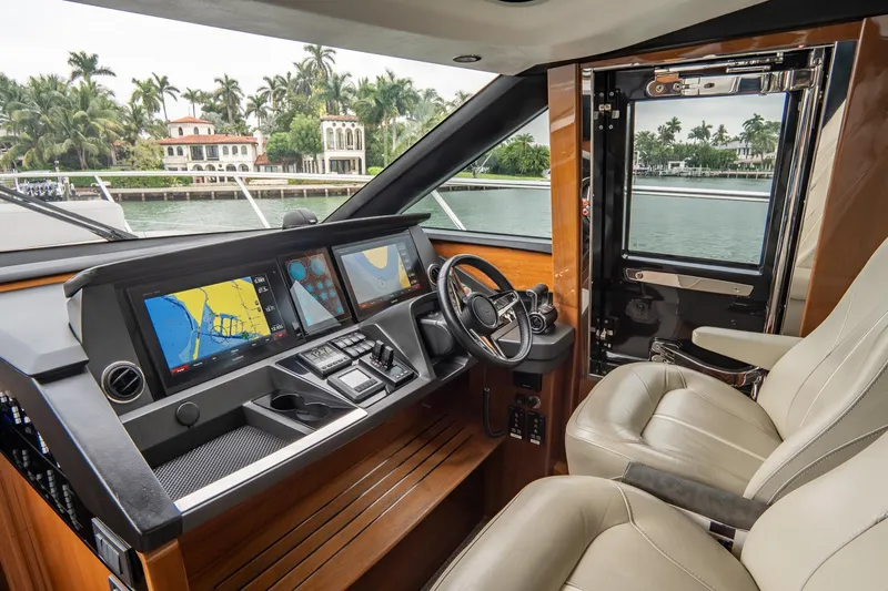 Cinderella Yacht Photos Pics Luxurious 2017 Princess S65 yacht cockpit with advanced navigation system and plush seating.