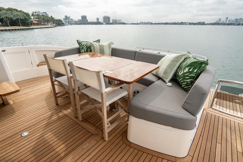 Cinderella Yacht Photos Pics Luxurious 2017 Princess S65 yacht deck with elegant seating and scenic waterfront view.