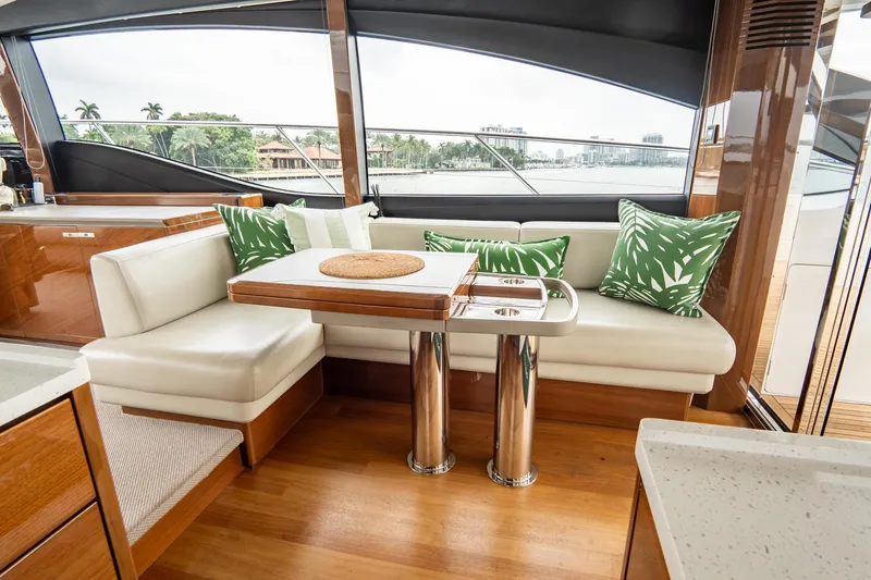 Cinderella Yacht Photos Pics Luxurious interior of 2017 Princess S65 yacht with elegant seating and tropical decor.