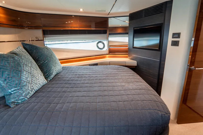 Cinderella Yacht Photos Pics Luxurious bedroom interior of 2017 Princess S65 yacht with modern design and elegant furnishings.