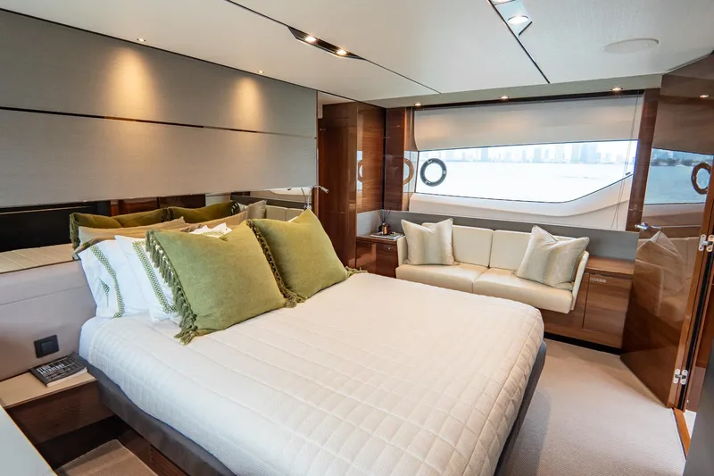 Cinderella Yacht Photos Pics Luxurious bedroom interior of 2017 Princess S65 yacht with elegant decor and large windows.