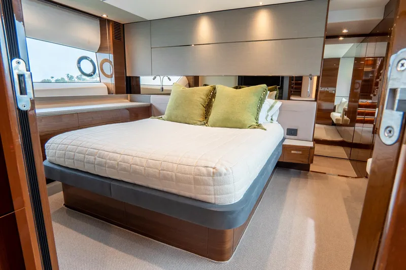 Cinderella Yacht Photos Pics Luxurious bedroom interior of 2017 Princess S65 yacht with modern design and elegant furnishings.