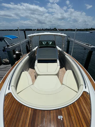  Yacht Photos Pics 2016 Chris-Craft Catalina 34 boat docked, showcasing spacious deck and seating.
