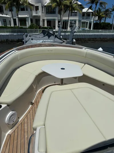  Yacht Photos Pics 2016 Chris-Craft Catalina 34 boat with cushioned seating and table.