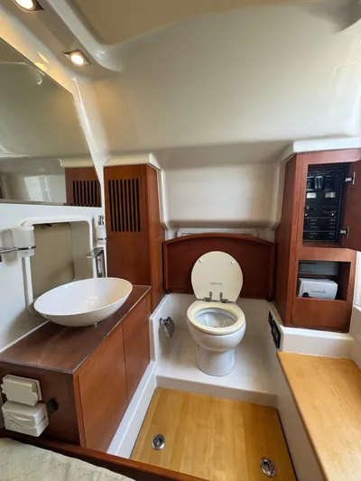  Yacht Photos Pics 2016 Chris-Craft Catalina 34 bathroom with modern fixtures and wooden cabinetry.