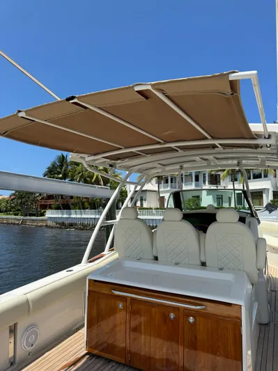  Yacht Photos Pics 2016 Chris-Craft Catalina 34 boat with shaded seating area and waterfront view.