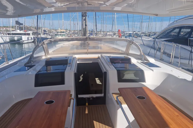  Yacht Photos Pics Cockpit view of 2019 Hanse 588 yacht docked in a marina.