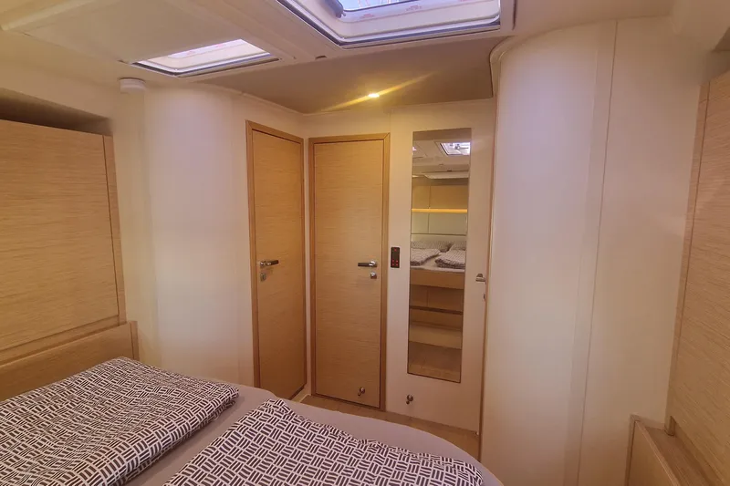  Yacht Photos Pics Interior of 2019 Hanse 588 yacht cabin with modern design and cozy bedding.