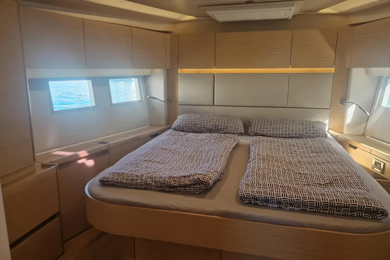  Yacht Photos Pics Luxurious 2019 Hanse 588 yacht cabin with modern design and comfortable bedding.