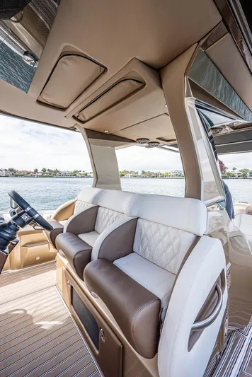 Yacht Photos Pics 2019 Nor-Tech 450 Sport Center Console interior with luxurious seating and waterfront view.