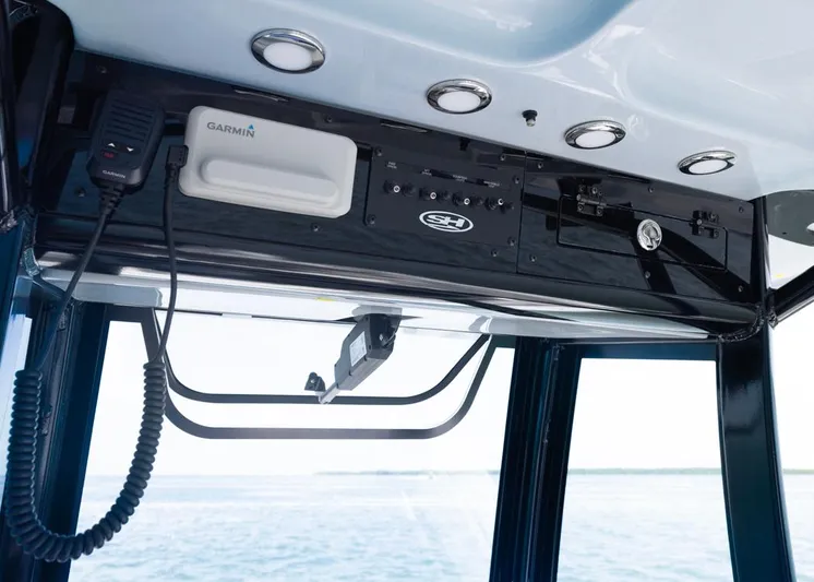  Yacht Photos Pics 2026 Sea Hunt Gamefish 27 helm with Garmin electronics and sleek black panel design.