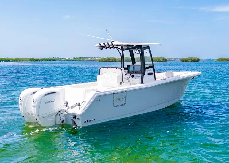  Yacht Photos Pics 2026 Sea Hunt Gamefish 27 boat on clear blue water, featuring dual Yamaha engines.