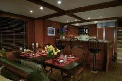Meander Yacht Photos Pics Interior of a 2003 Northern Marine Pilothouse Trawler, elegantly furnished dining area.
