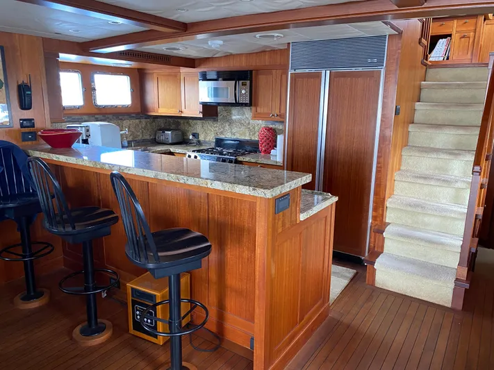 Meander Yacht Photos Pics Kitchen in 2003 Northern Marine Pilothouse Trawler with wood paneling.