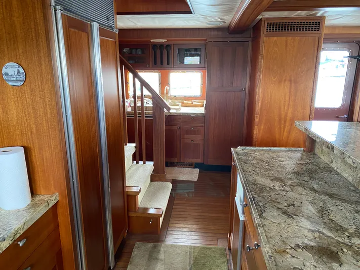 Meander Yacht Photos Pics 2003 Northern Marine Pilothouse Trawler interior with wood finish and granite countertops.