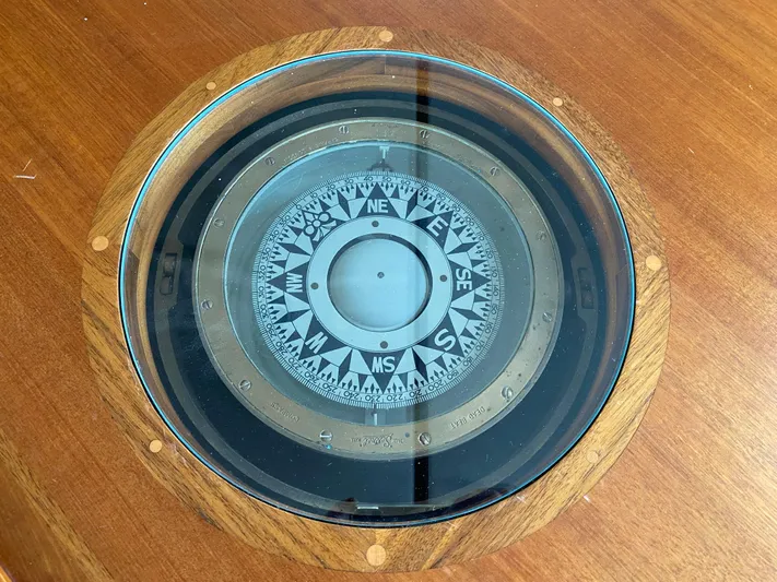 Meander Yacht Photos Pics 2003 Northern Marine Pilothouse Trawler compass on wooden surface.