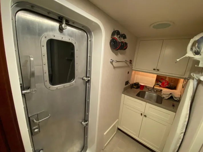 Meander Yacht Photos Pics Interior of 2003 Northern Marine Pilothouse Trawler with metal door and sink.