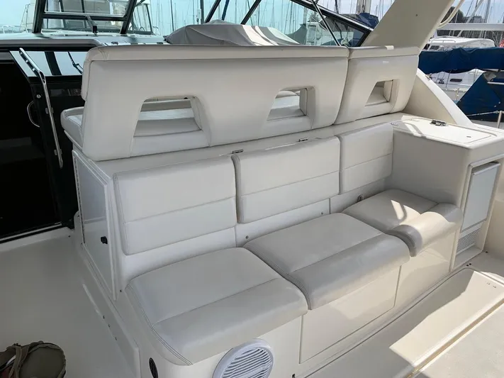 Sparrow Yacht Photos Pics 1995 Tiara Yachts 4000 Express interior seating with white upholstery and modern design.