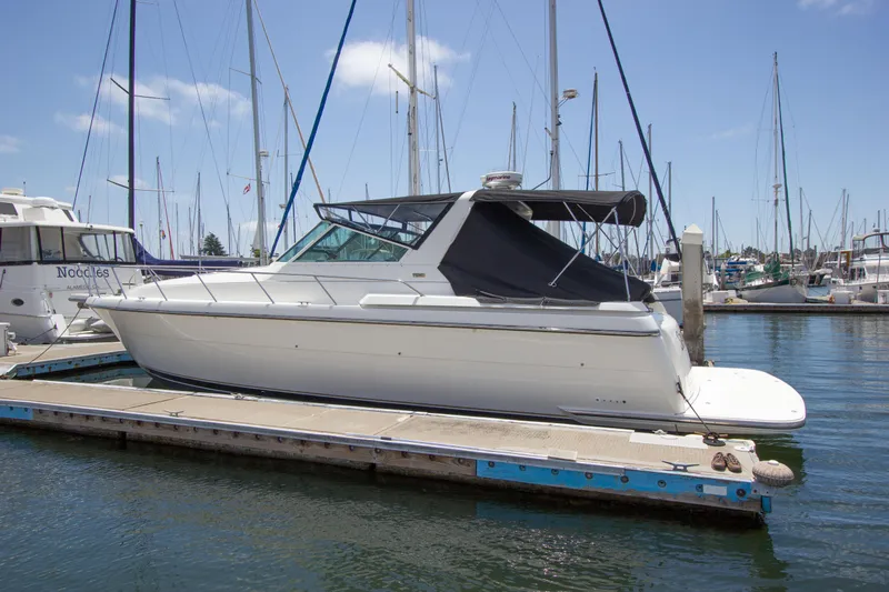 Sparrow Yacht Photos Pics 1995 Tiara Yachts 4000 Express docked at marina, clear sky, calm water.