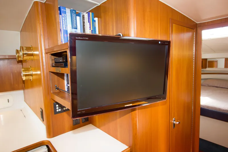 Sparrow Yacht Photos Pics Interior of 1995 Tiara Yachts 4000 Express with TV and wooden cabinetry.