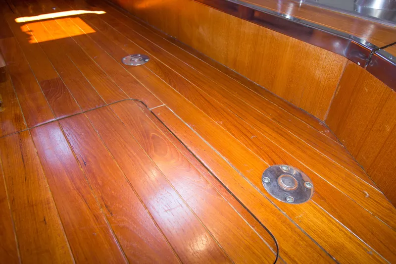 Sparrow Yacht Photos Pics Polished wooden deck of 1995 Tiara Yachts 4000 Express, showcasing craftsmanship and elegance.