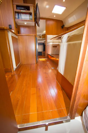 Sparrow Yacht Photos Pics 1995 Tiara Yachts 4000 Express interior with wooden flooring and cozy seating area.