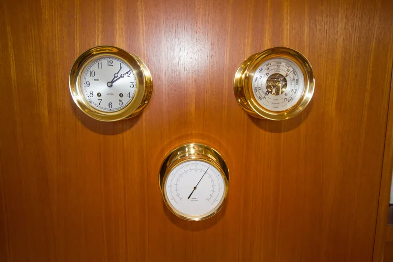Sparrow Yacht Photos Pics Gold-trimmed clock, barometer, and thermometer on Tiara Yachts 4000 Express, 1995 model.