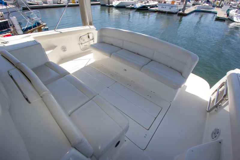 Sparrow Yacht Photos Pics 1995 Tiara Yachts 4000 Express, spacious white seating area, docked at marina.